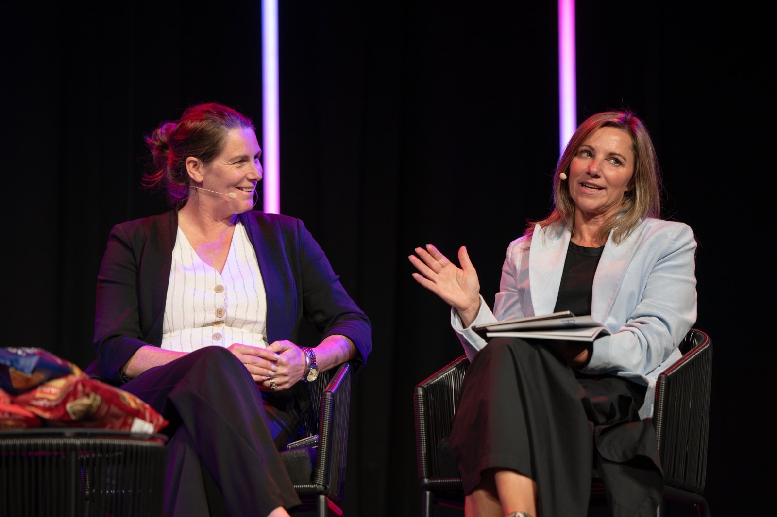 Dr Victoria Hatton in conversation on stage, mid gesture